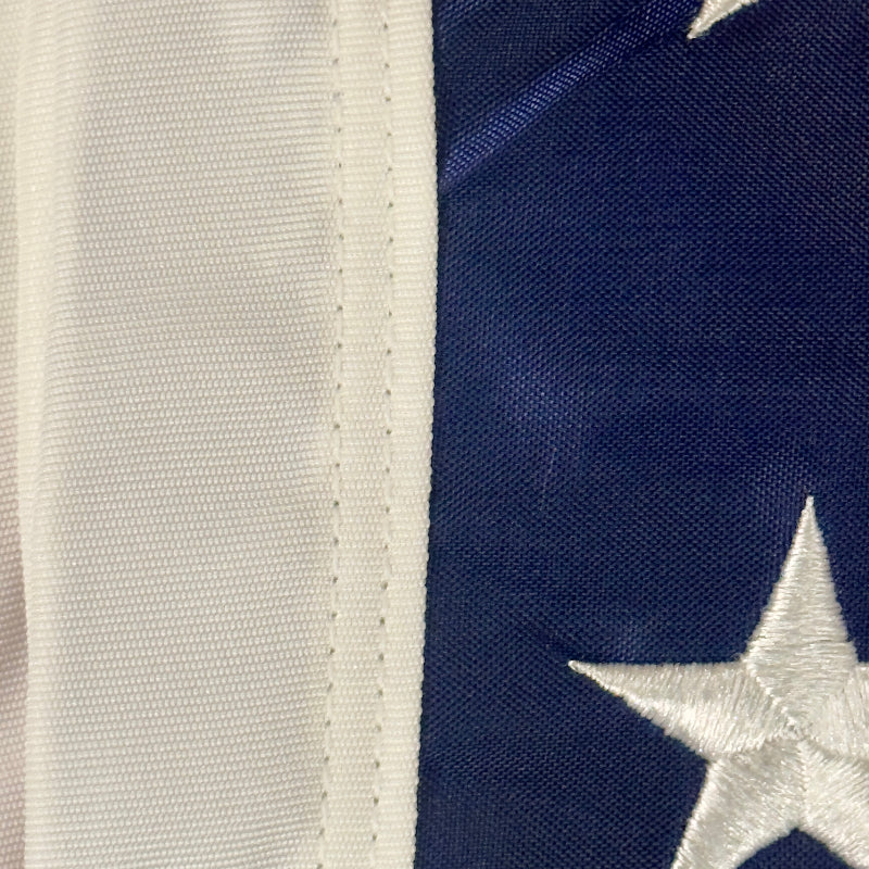 Close-up of a flag heard with blue background and white stars